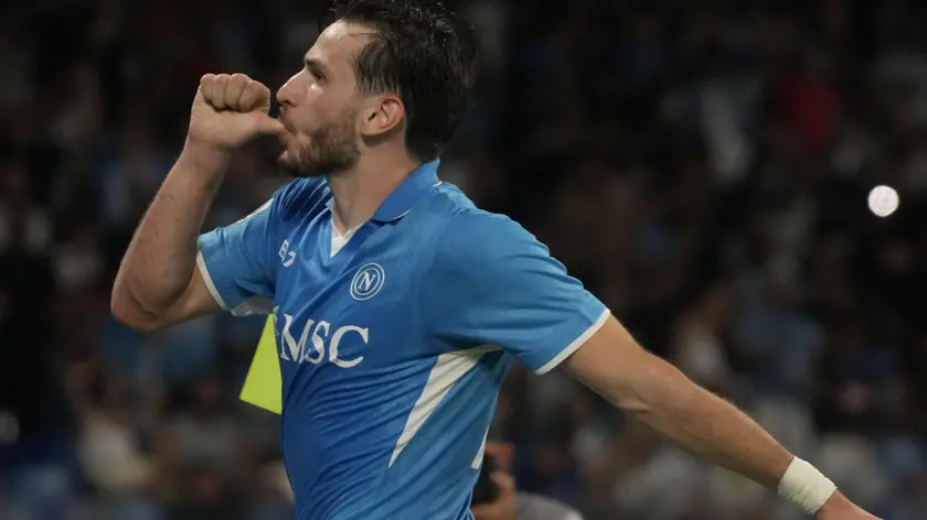 Napoli’s forward Khvicha Kvaratskhelia jubilates with his teammate after scoring the goal during the Italian Serie A soccer match SSC Napoli vs FC Bologna at "Diego Armando Maradona" stadium in Naples, Italy, 25 August 2024 ANSA/CESARE ABBATE