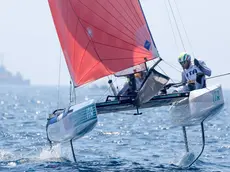 epa11530779 Ruggero Tita and Caterina Banti of Italy during the Nacra 17 mixed Multihull race of the Sailing competitions in the Paris 2024 Olympic Games, at the Marseille Marina in Marseille, France, 06 August 2024. The Italian crew leads ahead of the medal race. EPA/OLIVIER HOSLET