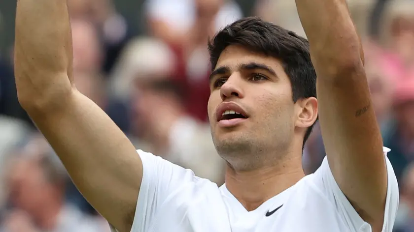 epa11474459 Carlos Alcaraz of Spain celebrates after winning his Men's Singles semifinal match against Daniil Medvedev of Russia at the Wimbledon Championships, Wimbledon, Britain, 12 July 2024. EPA/NEIL HALL EDITORIAL USE ONLY