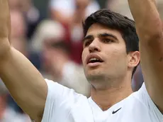 epa11474459 Carlos Alcaraz of Spain celebrates after winning his Men's Singles semifinal match against Daniil Medvedev of Russia at the Wimbledon Championships, Wimbledon, Britain, 12 July 2024. EPA/NEIL HALL EDITORIAL USE ONLY