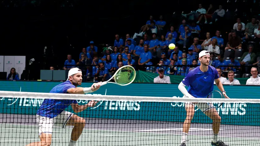 epa11599141 Italian double tennis team Simone Bolelli and Andrea Vavassori in action against Brazilian double tennis team Rafael Matos and Marcelo Melo during their doebles match of the Davis Cup Group Stage Finals in Casalecchio, Bologna, Italy, 11 September 2024. EPA/ELISABETTA BARACCHI