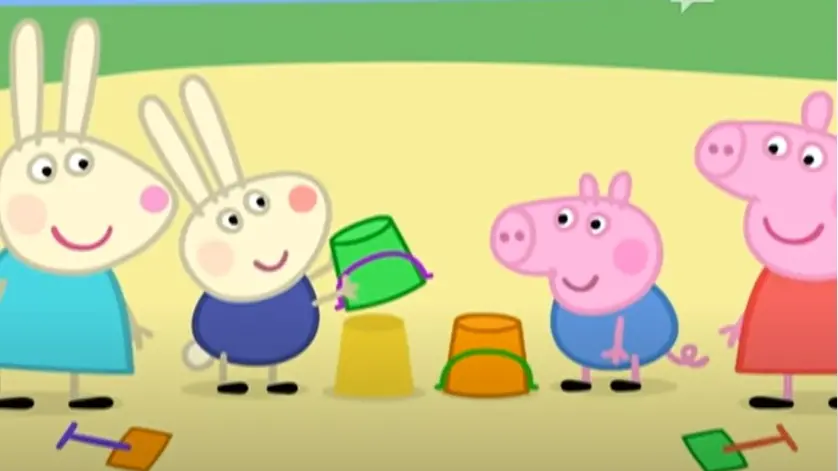 Richard Coniglio con il secchiello verde del cartone Peppa Pig