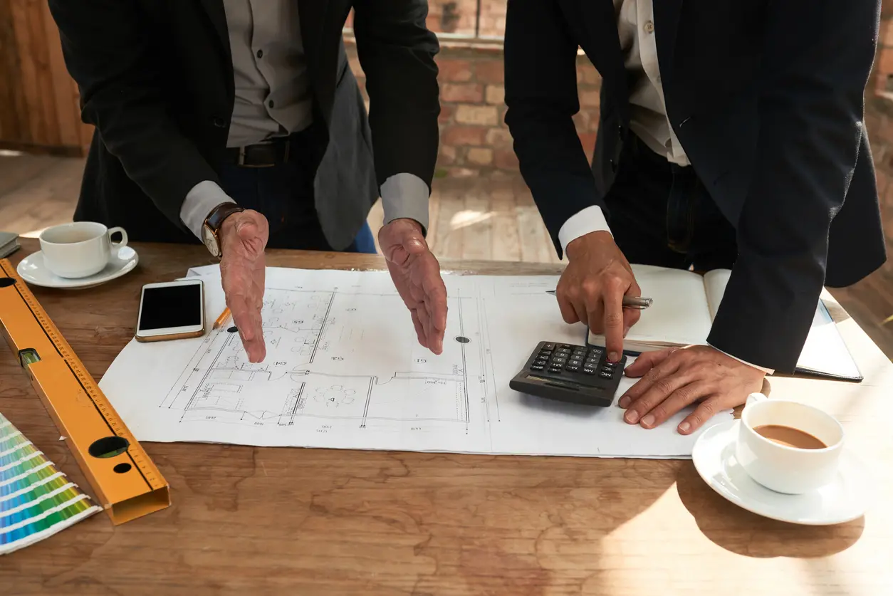 Business partners counting budget for design project