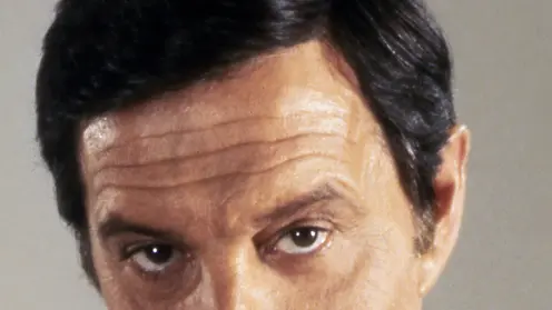 1983 --- Actor Louis Jourdan on the set of "Octopussy". --- Image by © Sunset Boulevard/Corbis