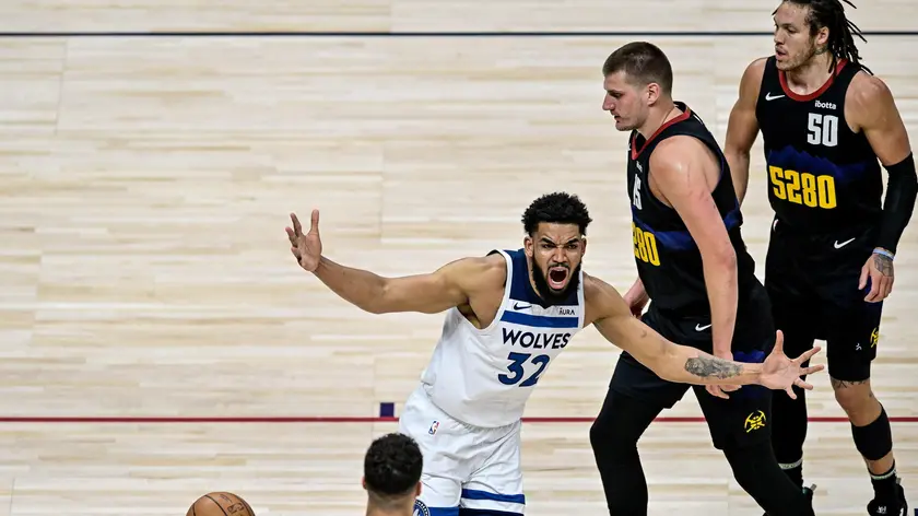 epa11323405 Minnesota Timberwolves center Karl-Anthony Towns celebrates after scoring as Denver Nuggets center Nikola Jokic (2-R) and forward Aaron Gordon look on in the first quarter of game two of the Western Conference semifinal series between the Minnesota Timberwolves and the Denver Nuggets at Ball Arena in Denver, Colorado, USA, 06 May 2024. EPA/DUSTIN BRADFORD SHUTTERSTOCK OUT