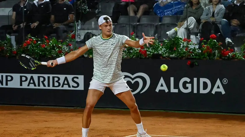 epa11333951 Holger Rune of Denmark in action against Luca Nardi of Italy (not pictured) during their men's singles match at the Italian Open tennis tournament in Rome, Italy, 11 May 2024. EPA/ALESSANDRO DI MEO