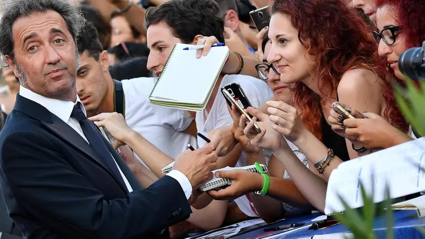 Italian director Paolo Sorrentino signs autographs as he arrives for the premiere of 'The Young Pope' at the 73rd Venice Film Festival in Venice, Italy, 03 September 2016. The movie is presented out of competition at the festival running from 31 August to 10 September. ANSA/ETTORE FERRARI