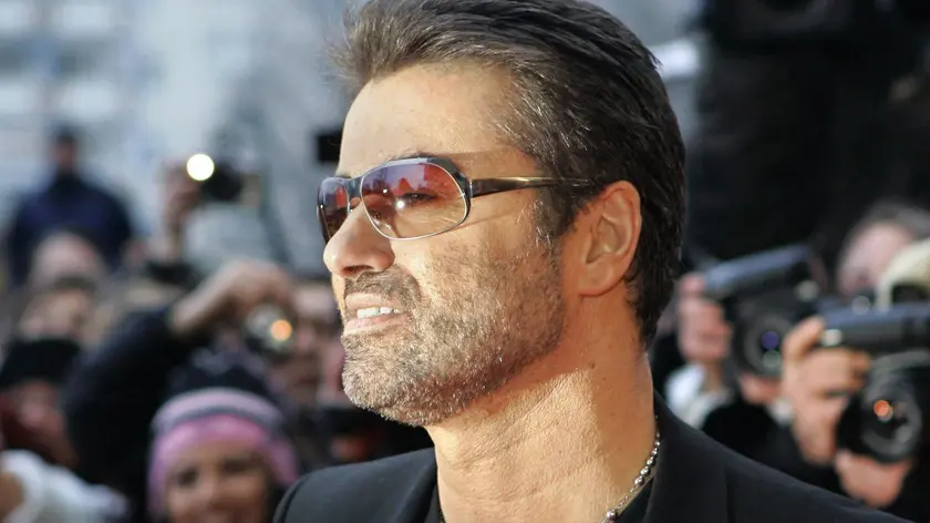 epa05688228 (FILE) - A file picture dated 16 February 2005 shows British pop singer George Michael smiling as he arrives for the presentation of the film 'George Michael: A Different Story', a documentary about his life, at the Berlinale Filmfestival in Berlin, Germany. According to reports on late 25 December 2016, British popstar George Michael has died peacefully at home at the age of 53, his publicist has announced. EPA/PEER GRIMM
