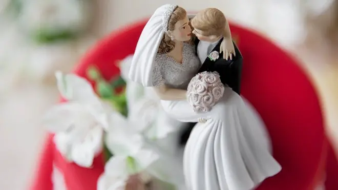 Wedding cake topper --- Image by © Kate Kunz/Corbis