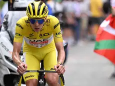epa11476267 Yellow jersey Slovenian rider Tadej Pogacar of UAE Team Emirates attacks on the ascent to Saint-Lary-Soulan - Pla d’Adet during the 14th stage of the 2024 Tour de France cycling race over 151km from Pau to Saint-Lary-Soulan Pla d'Adet, France, 13 July 2024. EPA/BERNARD PAPON / POOL