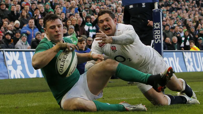 Ireland's Robbie Henshaw scores a try during the RBS Six Nations match at the Aviva Stadium, Dublin. PRESS ASSOCIATION Photo. Picture date: Sunday March 1, 2015. See PA story RUGBYU Ireland. Photo credit should read: Brian Lawless/PA Wire. RESTRICTIONS: Editorial use only. No commercial or promotional use without prior consent from IRFU. No alterations or doctoring. For further information please call +44 (0)115 8447447.