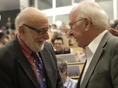 epa03901810 (FILES) Belgian physicist Francois Englert (L) and British physicist Peter Higgs (R), deliver the latest update in the search for the Higgs boson at the European Organization for Nuclear Research (CERN) in Meyrin near Geneva, Switzerland, 04 July 2012. The two scientists have won the Nobel prize in physics for their work on the theory of the Higgs boson, it was announced 08 October 2013. Peter Higgs, from the UK, and Francois Englert from Belgium, shared the prize. EPA/DENIS BALIBOUSE