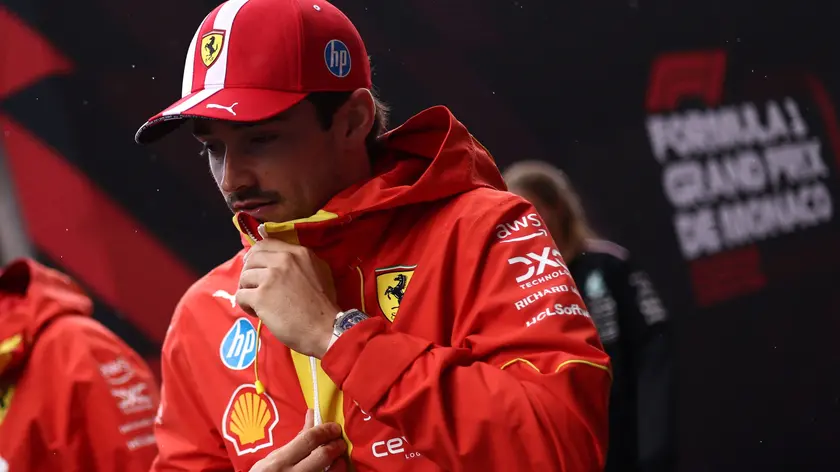 epa11363967 Scuderia Ferrari driver Charles Leclerc of Monaco walks in the paddock of the Circuit de Monaco in Monte Carlo, Monaco, 23 May 2024. The 2024 Formula 1 Grand Prix of Monaco is held on the Circuit de Monaco racetrack on 26 May 2024. EPA/ANNA SZILAGYI