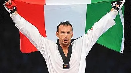 Carlo Molfetta of Italy celebrates the gold medal after his victory over Anthony Obame of Gabon in the Men +80kg final Taekwondo at the ExCel Centre in the London 2012 Olympic Games 11 August 2012. ANSA/CLAUDIO ONORATI