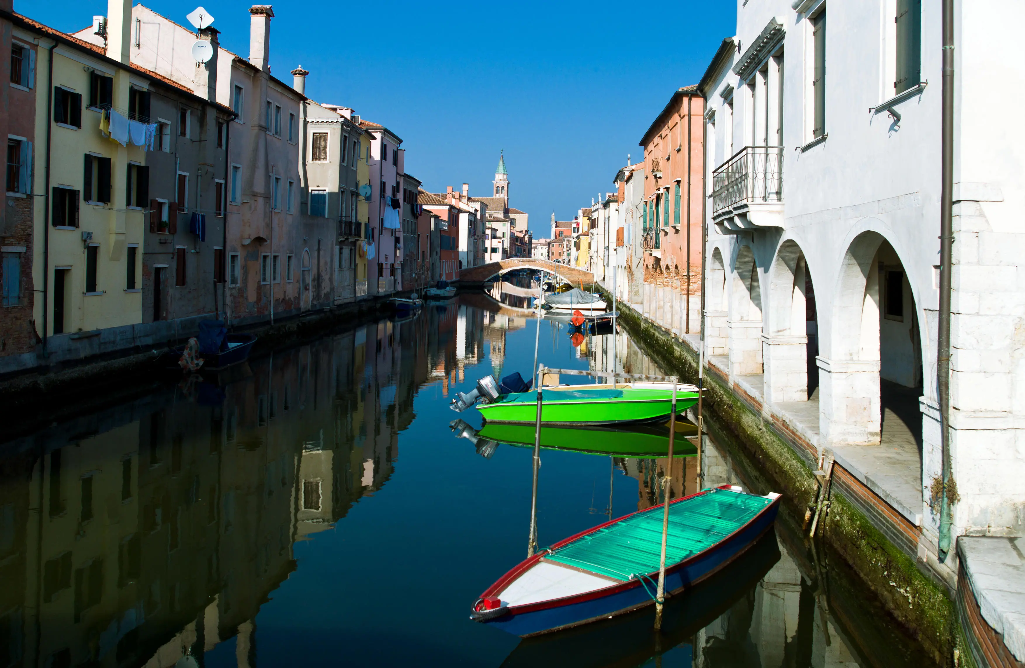 Italy, Chioggia, houses and boats on Canal Vena.