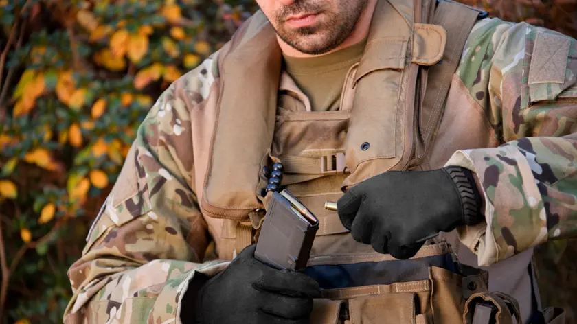 Soldier loading automatic weapon during training