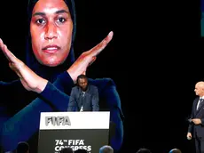 epa11347387 Togolese former soccer player Emmanuel Adebayor (L) speaks against racism in soccer next to FIFA President Gianni Infantino (R) during the 74th FIFA Congress in Bangkok, Thailand, 17 May 2024. More than 3,000 delegates from 211 affiliated associations and chiefs of six continental soccer governing bodies including soccer legends attend the meeting to discuss the soccer game and vote for the country to host the 2027 Women's World Cup. EPA/RUNGROJ YONGRIT