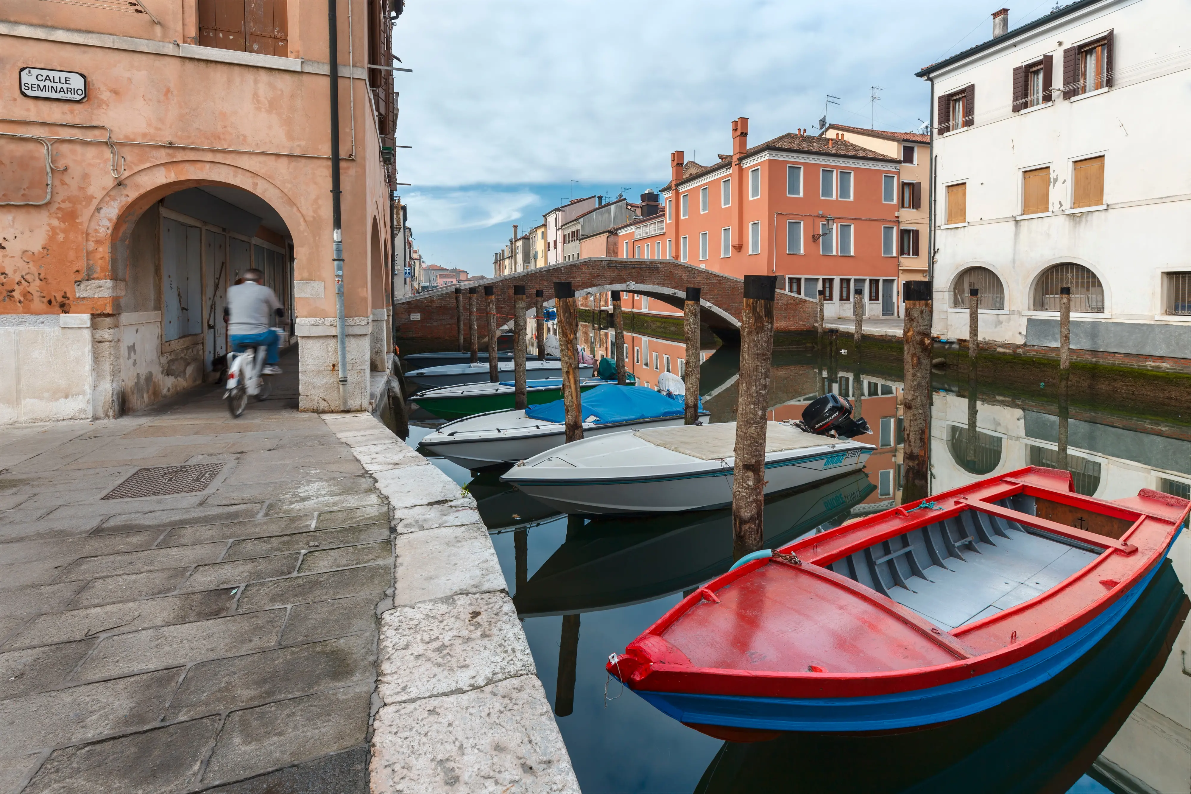 Europe, Italy, Veneto. Boats moored in a canal of Chioggia