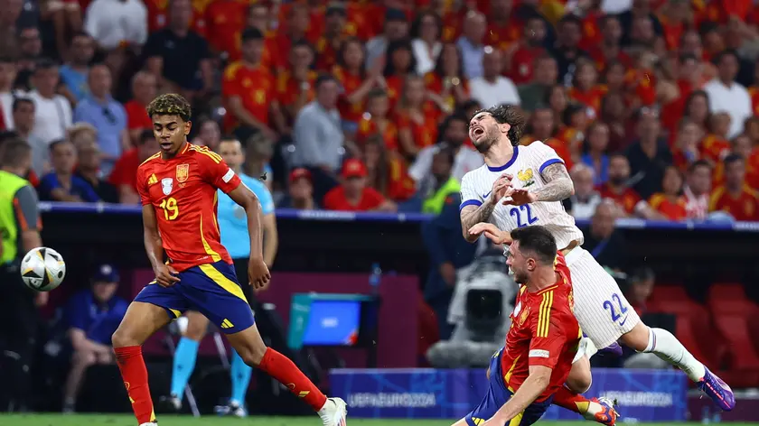 epa11469259 Theo Hernandez (R) of France reacts during the UEFA EURO 2024 semi-finals soccer match between Spain and France in Munich, Germany, 09 July 2024. EPA/FILIP SINGER