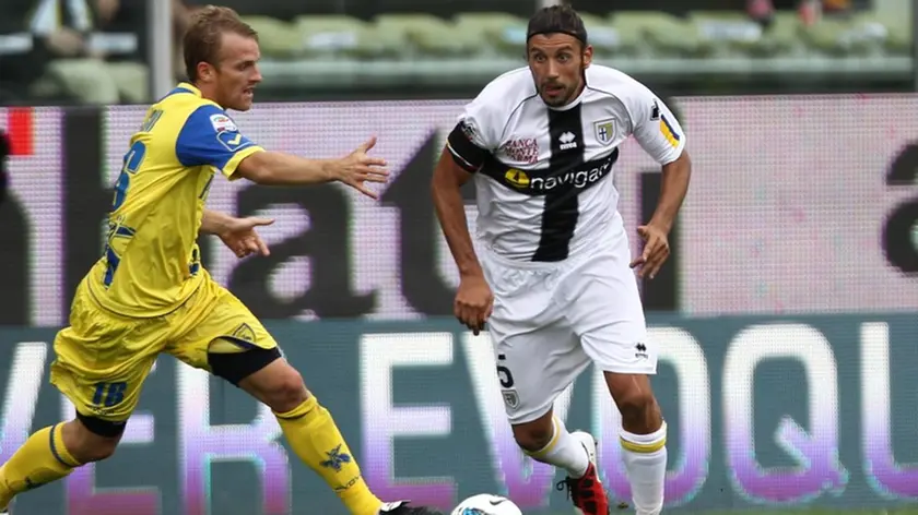 Parma's defender Cristian Zaccardo (R) in action with Chievo's midfielder Luca Rigoni (L) during their Italian Serie A soccer match at Tardini Stadium in Parma,18 September 2011. ANSA/FILIPPO VENEZIA