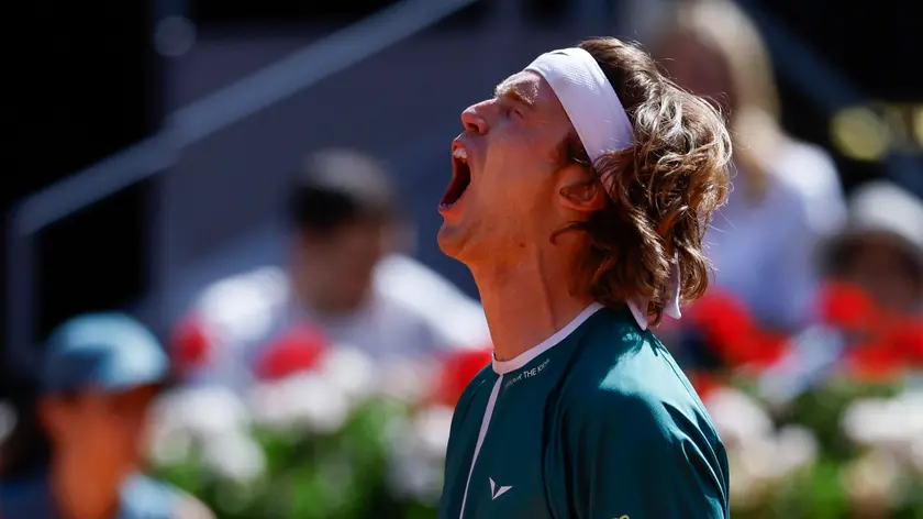 epa11316513 Andrey Rublev of Russia gestures as he plays against Taylor Fritz of the US during their semi-finals match at the Madrid Open tennis tournament in Madrid, Spain, 03 May 2024. EPA/Juanjo Martin