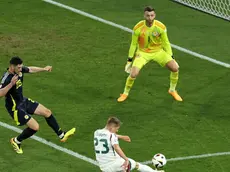 epa11433223 Kevin Csoboth of Hungary (C) in action on target against goalkeeper Angus Gunn (R) and Scott McKenna of Scotland during the UEFA EURO 2024 Group A soccer match between Scotland and Hungary, in Stuttgart, Germany, 23 June 2024. EPA/RONALD WITTEK