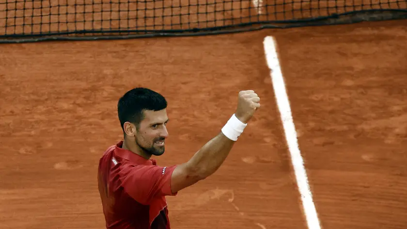 epa11388076 Novak Djokovic of Serbia celebrates winning his men's singles Round of 16 match against Francisco Cerundolo of Argentina at the French Open Grand Slam tennis tournament at Roland Garros in Paris, France, 03 June 2024. EPA/YOAN VALAT