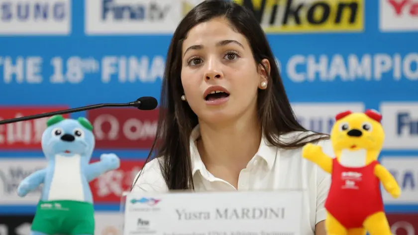 epa07741348 Syrian swimmer Yusra Mardini, who represents a refugee team, speaks during a news conference at the Main Press Center of the FINA World Championships at Nambu University Municipal Aquatics Center in Gwangju, South Korea, 26 July 2019. EPA/YONHAP SOUTH KOREA OUT