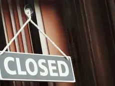 A shop doorway with a Closed sign.