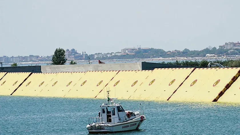 A view of the progressive raising of the last mobile gates of the Mose system from the lagoon in Venice, Italy, 10 July 2020, during a test of the system with the presence of Italian Prime Minister Giuseppe Conte. Media reports state that for the first time, only for a few hours, the Venice Lagoon has been completely closed to the sea for the first full test (with complete ban on maritime traffic) of the Mose's 78 mobile dams. The Mose system is intended to protect the city of Venice and the Venetian Lagoon from flooding. ANSA/ANDREA MEROLA