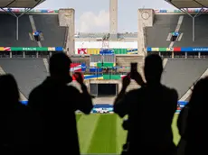 epa11395077 Media representatives take visuals of the Olympic stadium during the UEFA EURO 2024 - Stadium Open Media Day Berlin in Berlin, Germany, 07 June 2024. The stadium will host six games, three in the group stage, one round of 16, one quarter final and the final match. It will have a capacity of 71 thousand persons for the tournament. EPA/CLEMENS BILAN