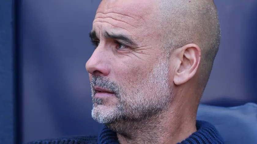 epa11353453 Manchester City's manager Pep Guardiola looks on during the English Premier League soccer match of Manchester City against West Ham United, in Manchester, Britain, 19 May 2024. EPA/ASH ALLEN EDITORIAL USE ONLY. No use with unauthorized audio, video, data, fixture lists, club/league logos, 'live' services or NFTs. Online in-match use limited to 120 images, no video emulation. No use in betting, games or single club/league/player publications.