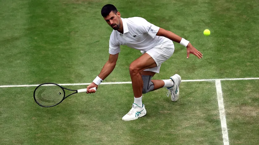 epa11474924 Novak Djokovic of Serbia in action during the Men's semifinal match against Lorenzo Musetti of Italy at the Wimbledon Championships, Wimbledon, Britain, 12 July 2024. EPA/ADAM VAUGHAN EDITORIAL USE ONLY