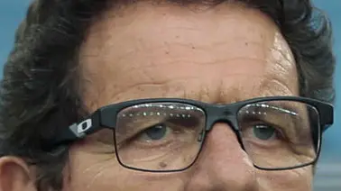 Russia's head coach Fabio Capello, center, stands in the dugout ahead of the group H World Cup soccer match between Algeria and Russia at the Arena da Baixada in Curitiba, Brazil, Thursday, June 26, 2014. (AP Photo/Ivan Sekretarev)