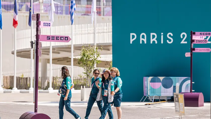 epa11485505 Paris staff members walk at the Athletes' Village of the Paris 2024 Olympic Games in Saint Denis, France, 18 July 2024. The Summer Olympics are scheduled to take place from 26 July to 11 August 2024 in Paris. EPA/CHRISTOPHE PETIT TESSON