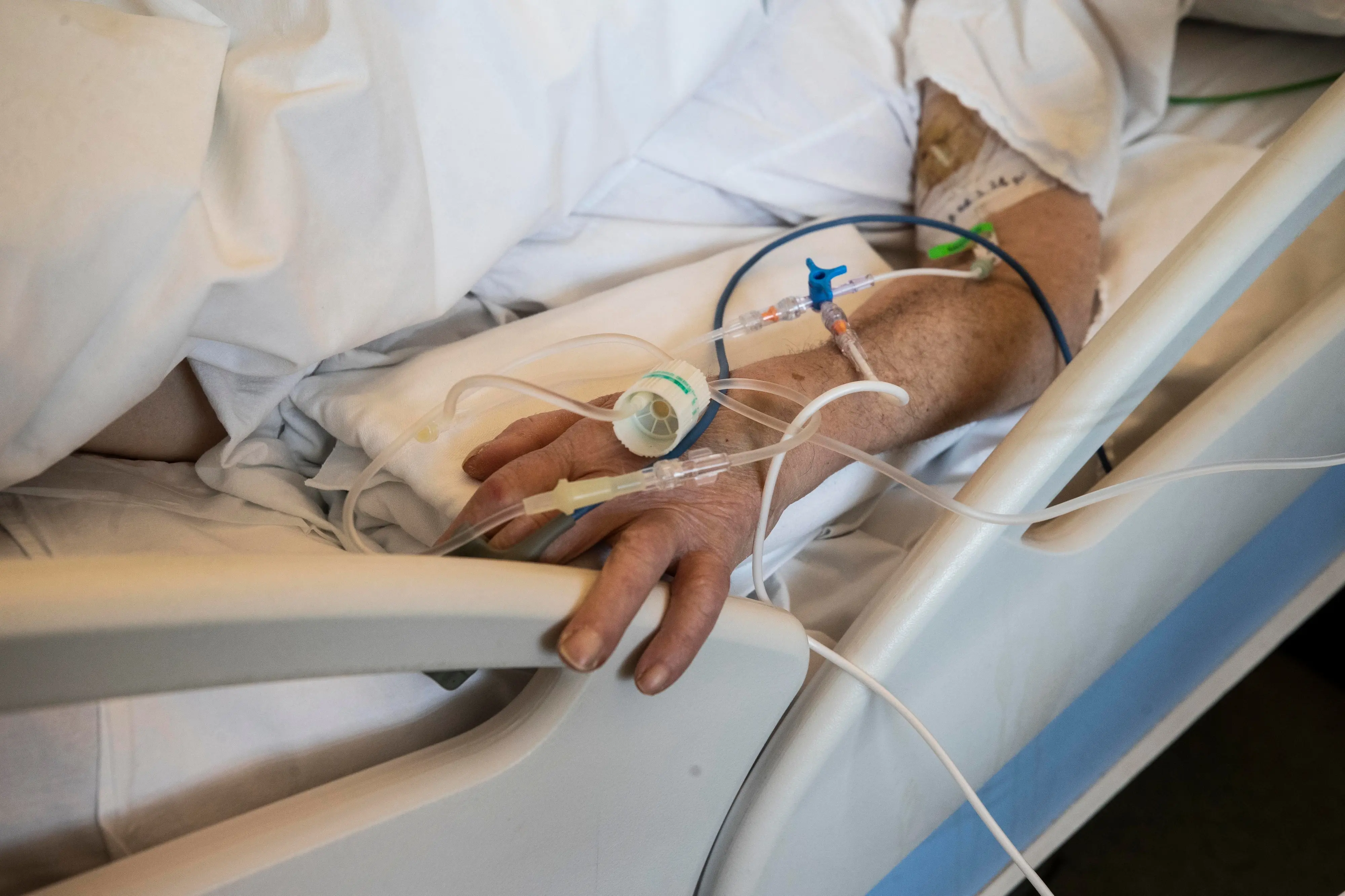 A patient under treatment lies on a bed in the emergency COVID-19 ward at the Mellino Mellini hospital in Chiari, northern Italy, Monday, March 8, 2021. The 160-bed hospital in the Po River Valley town of Chiari has no more beds for patients stricken with the highly contagious variant of COVID-19 first identified in Britain, and which now has put hospitals in Italy’s northern Brescia province on high alert. (AP Photo/Luca Bruno)
