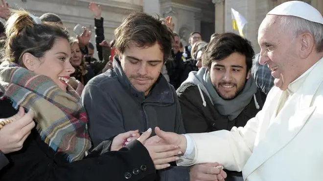 A picture released by Osservatore Romano shows Argentine singer and actress Martina Stoessel (L), who has the lead road in youth TV serie 'Violetta', that meets Pope Francis during a general audience on January 8, 2014. ANSA/OSSERVATORE ROMANO PRESS OFFICE ++ NO SALES, EDITORIAL USE ONLY ++