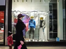 The city center is semi-deserted on Christmas Eve, amid the second wave of the Covid-19 Coronavirus pandemic, in Milan, Italy, 24 December 2020. Italy on Thursday entered a lockdown imposed by the government to stop social contact at Christmas feeding a new wave of COVID-19 contagion. The whole nation will be a 'red zone' for all but four days over the next two weeks, meaning bars, restaurants and non-essential shops are closed and people are only allowed out of the home if they have a good reason. ANSA/ MATTEO CORNER