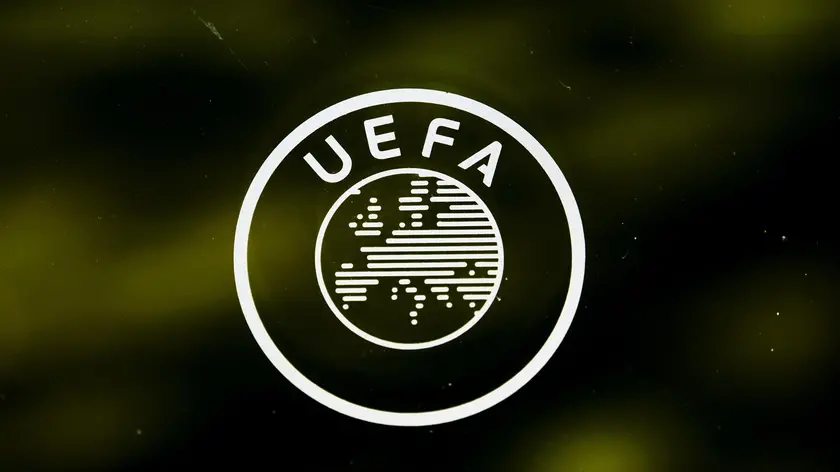 epa08337216 (FILE) - A UEFA logo is pictured through a window prior to the UEFA Europa League 2019/20 Round of 16 draw, at the UEFA Headquarters in Nyon, Switzerland, 28 February 2020 (re-issued on 01 April 2020). The UEFA has postponed on 01 April all planned matches of the national team's in June until further notice. The same applies to Champions and Europa League matches of this season. EPA/JEAN-CHRISTOPHE BOTT *** Local Caption *** 55912791