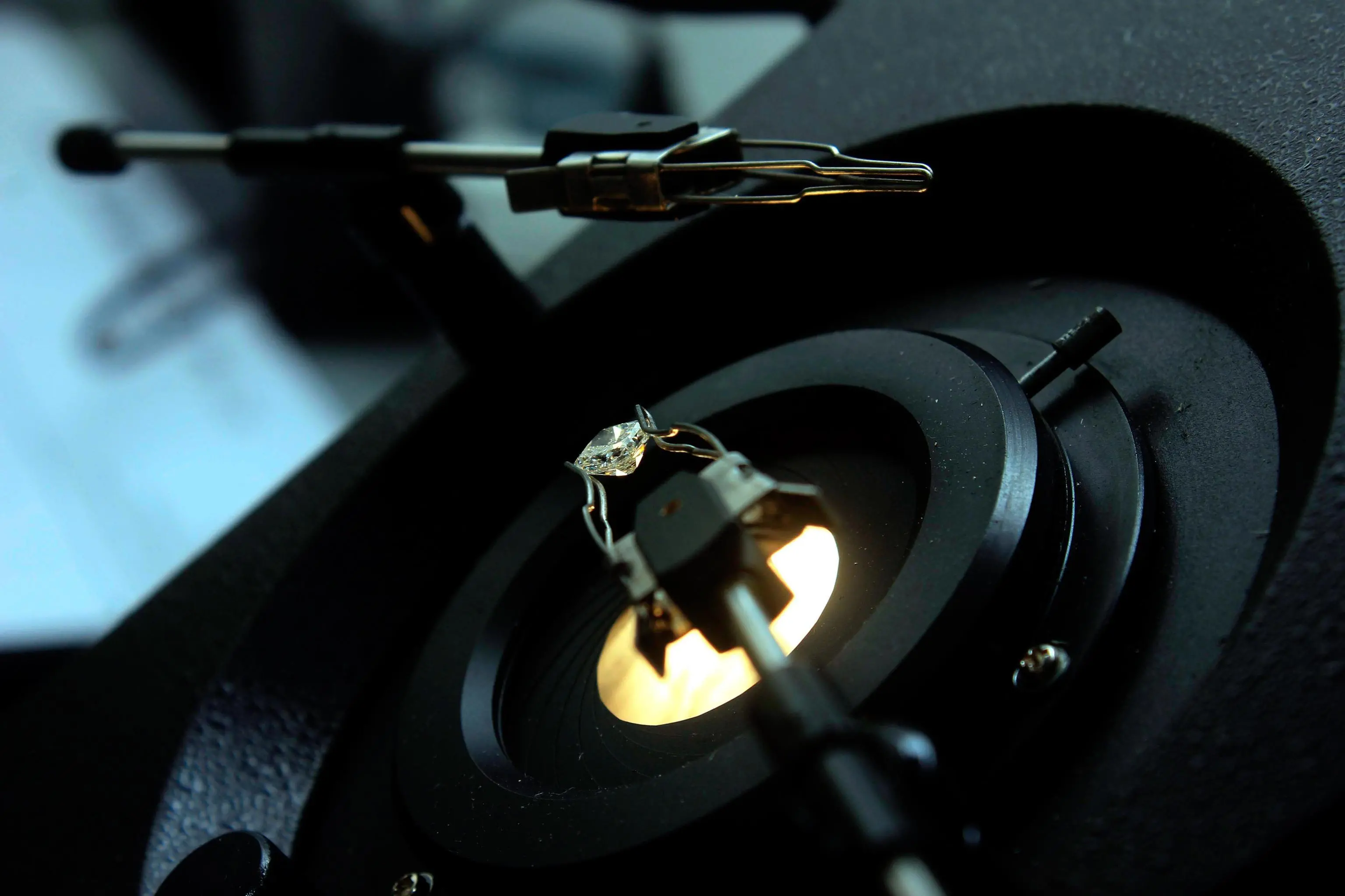 A worker polishes a diamond during the inauguration ceremony of Stone Polished Diamond (SPD) facility in Luanda, Angola, 12 February 2019. EPA/AMPE ROGERIO