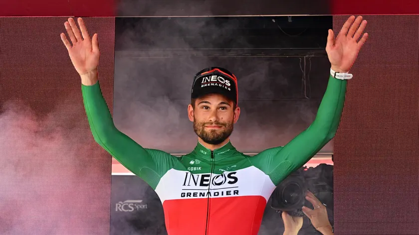 Italian rider Filippo Ganna of Ineos Grenadiers team celebrates on the podium after winning the 14th stage of the 107 Giro d'Italia 2024, an individual time trial (ITT) over 31.2 km from Castiglione delle Stiviere to Desenzano del Garda, Italy, 18 May 2024. ANSA/LUCA ZENNARO