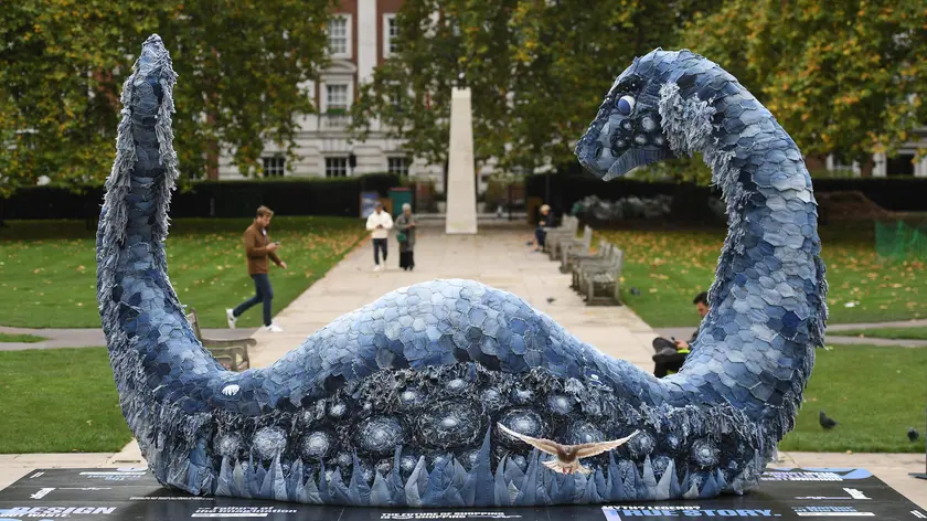 epa09550421 A sculpture of the Loch Ness monster made entirely from recycled denim jeans in London, Britain, 28 October 2021. 'Messy the COP Ness Monster' is a collaborative work by artist Billie Achilleos, streaming platform WaterBear, and circular denim brand MUD Jeans, aimed at highlighting the critical need for a circular economy ahead of the United Nations Climate Change Conference (COP26) in Glasgow. EPA/ANDY RAIN