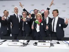 From left, the Mayor of Milan Giuseppe Sala, Italy's National Olympic Committee (CONI) president Giovanni Malago, Italy's Lombardy region President Attilio Fontana, Italy's Under Secretary of State Giancarlo Giorgetti, Italy's Olympic Gold Medallist in Fencing Diana Bianchedi, Italy's Veneto Region President Luca Zaia and Mayor of Cortina Gianpietro Ghedina pose after Milan-Cortina won the bid to host the 2026 Winter Olympic Games, during the first day of the 134th Session of the International Olympic Committee (IOC), at the SwissTech Convention Centre, in Lausanne, Switzerland, Monday, June 24, 2019. Italy will host the 2026 Olympics in Milan and Cortina d'Ampezzo, taking the Winter Games to the Alpine country for the second time in 20 years. (Laurent Gillieron/Keystone via AP)