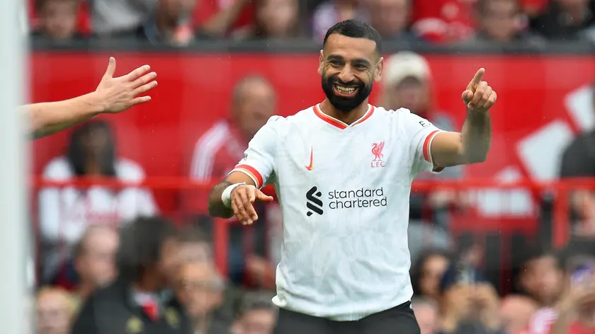 epa11578062 Mohamed Salah of Liverpool celebrates scoring for the 3-0 lead against Manchester United during the English Premier League soccer match of Manchester United against Liverpool FC, in Manchester, Britain, 01 September 2024. EPA/PETER POWELL EDITORIAL USE ONLY. No use with unauthorized audio, video, data, fixture lists, club/league logos, 'live' services or NFTs. Online in-match use limited to 120 images, no video emulation. No use in betting, games or single club/league/player publications.