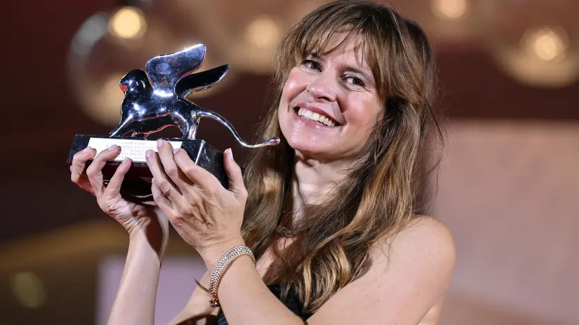 Italian filmmaker Maura Delpero holds the Silver Lion - Grand Jury Prize for his movie Vermiglio during the closing ceremony of the 81st annual Venice International Film Festival, in Venice, Italy, 07 September 2024. The 81st edition of the festival runs from 28 August to 07 September 2024. ANSA/ETTORE FERRARI