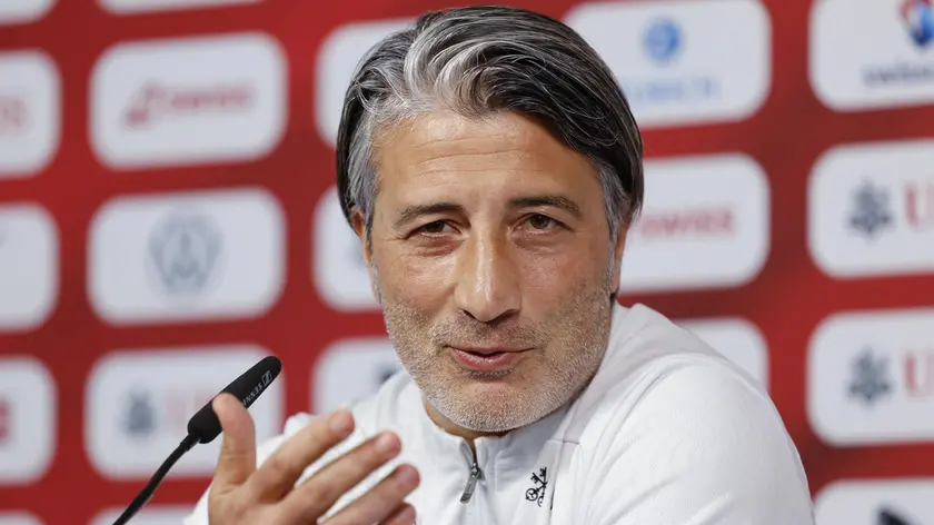 epa11452253 Switzerland's head coach Murat Yakin attends a press conference of the national soccer team in Stuttgart, Germany, 02 July 2024. EPA/PETER KLAUNZER