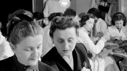 24 Mar 1956, Rome, Italy --- Original caption: The Fontana sisters, Zoe (left) and Micol look at some of the lace that will be used to make Margaret Truman's wedding dress. The Rome fashion house will not reveal the design of the dress that Miss Truman will wear when she marries newsman Clifton Daniel Jr., in Independence, Mo., April 21st. --- Image by © Bettmann/CORBIS