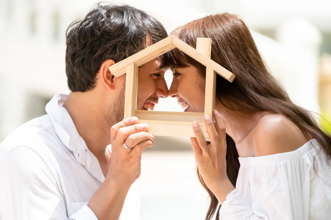 Young couple planning to buy a house and have happy living.
