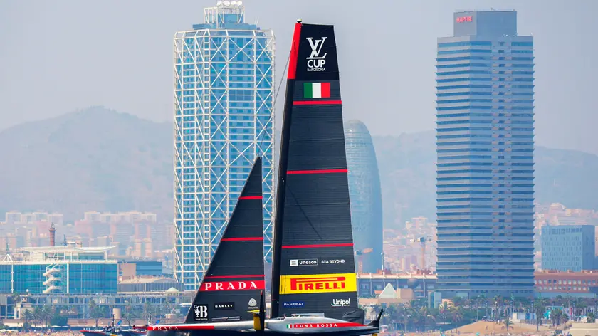 epa11559633 Luna Rossa Prada Pirelli compete in a match race during the Preliminary Regatta of the 37th America's Cup, in Barcelona, Spain, 22 August 2024. EPA/Siu Wu