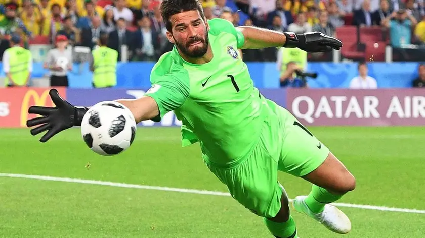 epa06845397 Brazil's goalkeeper Alisson in action during the FIFA World Cup 2018 group E preliminary round soccer match between Serbia and Brazil in Moscow, Russia, 27 June 2018. (RESTRICTIONS APPLY: Editorial Use Only, not used in association with any commercial entity - Images must not be used in any form of alert service or push service of any kind including via mobile alert services, downloads to mobile devices or MMS messaging - Images must appear as still images and must not emulate match action video footage - No alteration is made to, and no text or image is superimposed over, any published image which: (a) intentionally obscures or removes a sponsor identification image; or (b) adds or overlays the commercial identification of any third party which is not officially associated with the FIFA World Cup) EPA/FACUNDO ARRIZABALAGA EDITORIAL USE ONLY